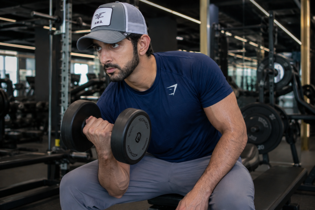 Fan-made Fazza workout image performing a seated dumbbell curl